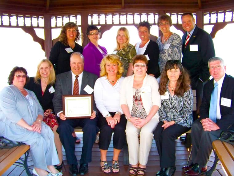 V. Daniel Robinson II and employees with the Employer of the Year award