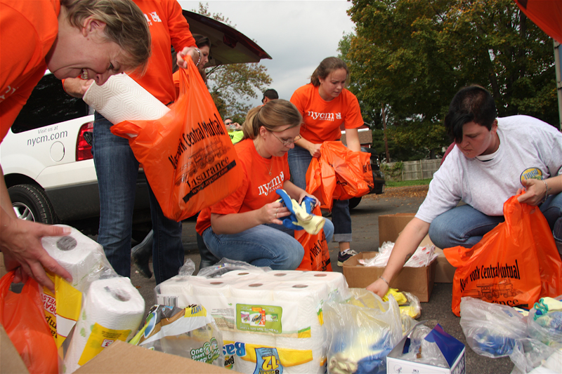 Volunteers sorting out supplies to give to neighbors who were devastated by flooding